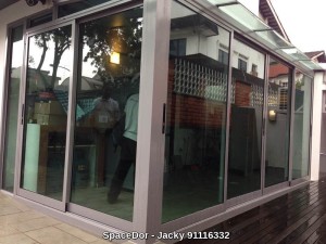 Enclosed balcony with sliding door and aluminium composite panel ceiling